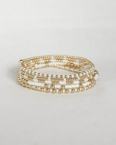 ‣ This listing is for a single bracelet, or stack of 5. ‣Olivia + Bella bracelets feature: * 2mm Seed Beads * 3mm 14k Gold Filled Beads * 1-5mm 14k Gold Filled Bead ‣Madi + Chloe + Luna bracelets feature: * 2mm Seed Beads * 2mm 14k Gold Filled Beads * 1-4mm 14k Gold Filled Bead Julisa Bracelets Feature:  ‣ Tight/Sturdy elastic, pre-stretched to prevent bracelet from stretching out ‣ Sizing according to wrist size ‣Sizing Tips:  Please measure your wrist for the best fit!  *Using a soft tape measure/string, measure around your wrist, above the wrist bone *Add length according to your desired fit:       * 0" - fitted, snug      * .25" - slight movement      * .5" -  relaxed      * .75"- loose      * 1" - extra loose *Please message us if you need any help with sizing!  ------- ‣Each bracelet Elegant Heishi Bead Bracelets With Tiny Beads, Gold Heishi Beads Stackable Bracelets, Gold Stackable Beaded Bracelets With Heishi Beads, Minimalist White Bracelet With Gold Beads, White Bracelets With Tiny Beads, White Rondelle Jewelry With Tiny Beads, White Stackable Beaded Bracelets For Everyday, White Round Bracelet With Tiny Beads, White Tiny Beads Jewelry For Everyday