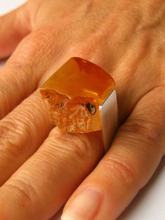 "RING  Handmade Baltic Amber, combined with a matt silver (925). Amber Size: approx.  0,89\" x 0,8\" Colour: orange yellow The circuit is an open ring, adjustable - beautiful and elegant - For customers outside European Union return or exchange is not possible." Orange Rectangular Jewelry As Gift, Modern Orange Sterling Silver Jewelry, Orange Hallmarked Ring As Gift, Modern Orange Rings For Gifts, Modern Orange Rings For Gift, Modern Orange Rings As Gifts, Handmade Orange Rings As Gift, Handmade Orange Rings For Gifts, Minimalist Orange Jewelry For Gifts