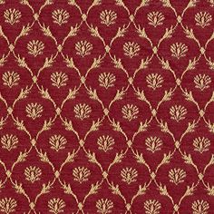 a red and gold fabric with leaves on it