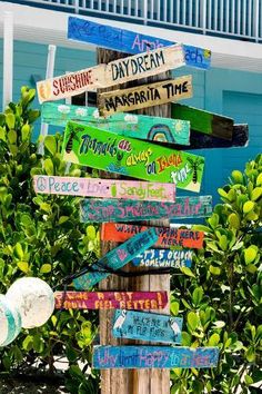 a wooden sign with many different signs on it