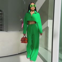 Infuse your wardrobe with a splash of color with our Vibrant Leisure Two-Piece Set, available in eye-catching green and vivid orange. Each set is designed for the woman who dares to stand out and enjoys the blend of comfort and contemporary style. Make a bold statement while embracing the ease of a coordinated ensemble. Key Features: • Bold Colors: Choose between the lush green and the electric orange sets to suit your mood or occasion. • Relaxed Fit: The soft fabric ensures a comfortable fit, perfect for a day in or a casual outing. • Versatile Styling: Pair it with sneakers for an athleisure look or with heels for an evening out. • Crop Top & High-Waisted Pants: The stylish crop top and high-waisted pants flatter any figure, giving you a chic silhouette. Sizes: Available in women’s sizes Electric Orange, Stylish Crop Top, Mid Waist Pants, 2024 Outfits, Tracksuit Pants, Pants Suit, 19 Days, Simple Shirts, Casual Sets