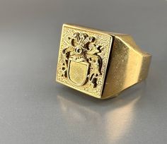 A superb 8k gold mid-century German signet ring. Beautiful crest cartouche, solid gold, hallmarked with two hallmarks (gold & maker's mark). The ring has a hefty 5.5 g weight. Material: 8k gold, hallmarked Total weight: 5.5 g US Size: approx. 9 (EU size 59 1/2) Box on the photos not included. Pocket Compass, Vintage Compass, Compass Pendant, Signet Ring Men, Signet Rings, Maker's Mark, Slovenia, Signet Ring, Coat Of Arms