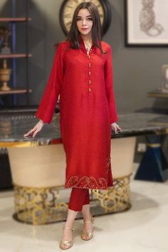 Cast a spell with this red silk trouser suit which features beautiful embroidery work..This chinese collar neck and full sleeve party wear dress designed using resham work.Present with silk cigarette pants in red color with beige net dupatta.Cigarette pant is plain.Dupatta is also plain.This trouser suit can be customised up to maximum size available in inches 68. Slight color variation may occur due to photographic reasons. Red Raw Silk Salwar Kameez For Celebration, Red Slub Silk Unstitched Suit For Festivals, Luxury Red Slub Silk Unstitched Suit, Transitional Red Slub Silk Salwar Kameez, Semi-stitched Red Raw Silk Suit, Resham Embroidery, Party Wear Dress, Resham Work, Red Trousers