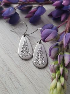 Lupine Teardrop Dangle Earrings The design is raised on the charm.  Earring measures 1 x .5 inch, Stainless Steel charms and earwires.  Packaged on an earring display card or in a jewelry box when shipped. Flower Shaped Jewelry With French Hook For Gifts, Silver Dangle Flower Earrings For Everyday, Hypoallergenic Teardrop Earrings As Gift, Hypoallergenic Teardrop Earrings For Gift, Flower Drop Earrings With French Hook, Nickel-free Sterling Silver Teardrop Flower Earrings, French Hook Drop Flower Earrings Gift, Flower Drop Earrings With French Hook For Gift, Teardrop Flower Earrings With Ear Wire As Gift