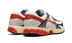 The Nike Zoom Vomero 5 "USA" is a patriotic colorway of the retro running and lifestyle shoe.  The Nike Zoom Vomero 5 debuted in 2010 and was later part of the popular Y2K sneaker trend in the 2020s.  Here, on the “USA” colorway, the shoe sports the colors of the American Flag: red, white, and blue.  Specifically, the upper features a Summit White mesh base and Navy leather overlays.  A Picante Red Swoosh can be found on both sides, while more red accenting appears on the heel overlay and on the heel of the rubber outsole.  Classic “Nike Zoom Vomero 5” detailing is located on the tongue tag.  A cream midsole gives the shoe an aged look.  Release date: June 29, 2024 Nike Zoom Vomero 5, Zoom Vomero 5, Vomero 5, Usa Shoes, Sneaker Trend, Stadium Goods, Trending Sneakers, Navy Leather, White Mesh