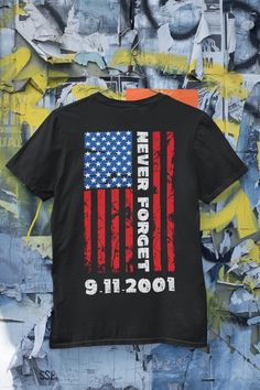 If you're looking for a shirt that shows your support for the 9-11 Memorial Shirt, then look no further! This comfortable and stylish shirt features a patriotic design in tribute to those who lost their lives on September 11th, 2001. Whether you're wearing it as a casual shirt or dressing up for a special occasion, this shirt is sure to make a statement. We will never forget what happened on September 11th, 2001, and we hope that this shirt can help remind others of that day as well. Thank you f Graphic Print Short Sleeve Top For Remembrance, Memorial Day Streetwear T-shirt With Letter Print, Letter Print Tops For Streetwear, Memorial Day American Flag Print T-shirt For Streetwear, Patriotic T-shirt For Memorial Day Streetwear, Memorial Day American Flag Print Top For Streetwear, Memorial Day American Flag Print Tops For Streetwear, American Flag Print Tops For Memorial Day Streetwear, Patriots Day