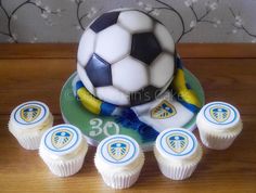 a cake with cupcakes and a soccer ball on it