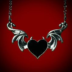 Devil’s heart necklace is the perfect spooky accessory to wear if you love to glamour your dark side! Pair this with our sterling silver bat wing ring to make the perfect accessory combo! material: zinc alloy 20” chain Gothic Winged Jewelry Gift, Gothic Winged Jewelry For Gifts, Gothic Heart Pendant Metal Jewelry, Gothic Heart Necklaces With Heart Charm, Emo Heart-shaped Jewelry For Valentine's Day, Gothic Sterling Silver Jewelry With Adjustable Chain, Edgy Jewelry For Valentine's Day Party, Emo Metal Jewelry For Parties, Gothic Heart-shaped Jewelry With Adjustable Chain