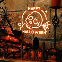 a lighted sign that says happy halloween on it