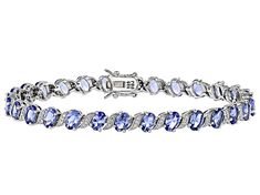 9.50ctw Oval Tanzanite With 0.46ctw Round White Zircon Rhodium Over Sterling Silver Tennis Bracelet. Measures Approximately 0.24"W. Box clasp with Double safety lock. Accent stones primarily zircon. Oval Gemstone Tennis Bracelet In Fine Jewelry Style, Oval Diamond Tennis Bracelet With Gemstones, Oval Gemstone Tennis Bracelet For Anniversary, Oval Gemstone Accent Bracelets For Anniversary, Oval Bracelets With Gemstone Accents For Anniversary, Oval Anniversary Bracelets With Gemstone Accents, Silver Tennis Bracelet, Bracelet Box, Tanzanite Gemstone