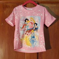 New Six Disney Princesses Pink Tee * 5.0 Star Top-Rated Seller Posh Ambassador * Smokefree Home * Chihuahua Friendly Home * Same Day/Next Day Shipping (Fast Shipper!) Bundle Items And Save Even More!! Pink Short Sleeve Shirt With Character Print, Themed Tops For Disney Trips With Character Print, Disney Themed Character Print Tops, Themed Cartoon Print Tops For Disney Trips, Playful Pink Top For Disney Fan Events, Disney Cotton Tops For Playwear, Themed Short Sleeve Top With Sublimation Print, Casual Pink Shirt For Disney Fan Events, Disney Character Print Tops For Disney Trips