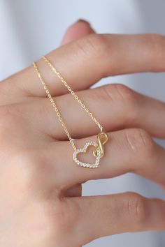 Love can be found even in the smallest details. This infinity heart necklace may seem like a small detail, but it definitely carries the biggest meaning. It is the most elegant representative of immortal love. DETAIL * Made to order. * 100% 14K Solid Gold * Gold Color Selection: Yellow Gold, Rose Gold, White Gold * Cubic zirconia * Pendant Lamp Height: 21 mm / 0.82 inch * Pendant Width: 12 mm / 0.47 inch * Length: 14", 16", 18", 20", 22" (I have a little note in the photos that may help you.) * Ready to Ship in 1-3 Business Days * 100% sourced from the USA * Free returns within 14 days from order date A B O U T ∙ U S * All customization is done by hand. Because it's better this way. * 100% Ethically Sourced, USA raw materials * Our beautiful packaging was created with love and fun on a mot Infinity Chain Necklaces, Infinity Necklaces For Valentine's Day, Elegant Necklace With Adjustable Chain For Anniversary Gift, Infinity Necklace For Mother's Day, Elegant Heart Necklace With Adjustable Chain For Anniversary, Delicate 14k Gold Heart Necklace With Adjustable Chain, Elegant 14k Gold Infinity Necklace, Elegant White Gold Heart Necklace With Delicate Chain, Anniversary Heart Necklace With Delicate Chain