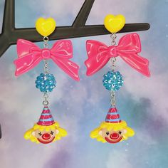 Bright and colorful party hat clown earrings - Halloween earrings - Circus jewelry - carnival - Lolitafashion earrings - post dangle earrings The perfect earrings for clowning around! Makes a great gift idea as well. Both wide plastic and silicone rubber backings included for comfort (pictured with plastic backings) **Stainless steel earring posts are hypoallergenic and nickel free Made of resin / plastic Charms are one sided and flat on the back Earring length is: 3 1/4" (in) Earring width is: Pink Novelty Earrings For Party, Novelty Party Jewelry Made Of Plastic, Novelty Plastic Party Jewelry, Yellow Plastic Party Jewelry, Fun Adjustable Earrings For Birthday, Fun Dangle Earrings For Birthday, Playful Halloween Earrings For Gift, Playful Halloween Earrings For Gifts, Fun Plastic Jewelry For Party