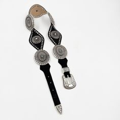 Indulge in the elegant and exclusive style with our Lyra Concho Belt. Made from luxurious black Italian leather, this western-style belt features intricate silver concho hardware and stud details. The silver buckle set adds the perfect finishing touch. Elevate any outfit and make a statement with this sophisticated accessory. Details: Smooth black Italian leather Silver plated buckle set and hardware Sourced in Italy Made in California Texas Sun, Style Bundle, Concho Belt, Western Belt, Western Belts, Leather Silver, Western Style, Black Belt, Italian Leather