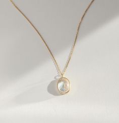 Luminous! Mystical! A shimmery moonstone set in a classic bezel setting. Makes for an excellent gift for someone you love (or you - you are very much included in that category!). Gold Polished Moonstone Jewelry, Gold Moonstone Jewelry With Polished Finish, Elegant Moonstone Necklace In Yellow Gold, Elegant Yellow Gold Moonstone Necklace, Elegant Everyday Moonstone Ring, Elegant Gold Moonstone Birthstone Ring, Elegant Oval Pendant Jewelry With Bezel Setting, Elegant Moonstone Ring With Bezel Setting, Timeless Yellow Gold Moonstone Ring