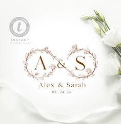 two white flowers are sitting on top of the wedding day program booklets, which also include an as and s logo