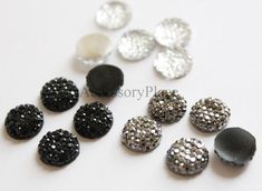 black, white and silver sequinized buttons