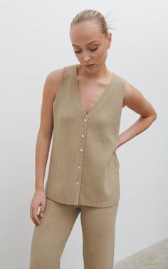 Product details    knit - taupe                                                v-neckline  functional button front  pairs back with kourtney trouser or skirt  relaxed fit. Summer, knitted/wool, jeans-and-a-nice-top, Brunch, Style - Preppy, Smart, Sleeveless, V-Neck Pretty Lavish, Fit Summer, Knitted Tops, Airport Outfit, High Waisted Trousers