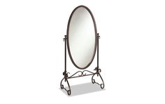 a large oval mirror sitting on top of a metal stand