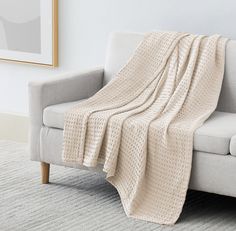 a couch with a blanket on top of it