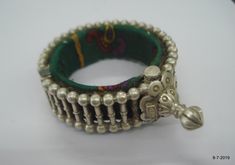 "VINTAGE ANTIQUE GREAT DESIGN TRIBAL OLD SILVER HINGE BRACELET BANGLE (KAKAN) FROM RAJASTHAN INDIA. Silver guard bangles (Khatria or bangri gokru) with solid balls perimeters. Worn by DANGEE and PATEL tribal people of Rajasthan. One quarter-hinged part can be opened by central pin. Piece is good worn with a great antique look. See similar samples in\" Traditional jewelry of India\" by Oppi Untractht. Inner diameter - 4.8 cm(1.89\") Outer diameter - 6.8 cm(2.7\") Inner circumference - 15 cm(5.9\" Antique Silver Bracelet For Festivals, Vintage Oxidized Finish Bracelets For Festivals, Vintage Oxidized Bracelets For Festivals, Antique Silver Bangle Bracelets For Festivals, Vintage Oxidized Finish Bangle For Festivals, Vintage Oxidized Bangle For Festival, Vintage Festival Bracelet Jewelry, Vintage Festival Jewelry Bracelet, Antique Silver Bracelets For Festivals