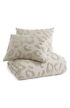 two pillows sitting on top of each other