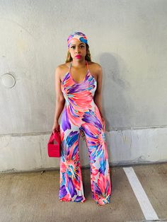 Take on the warmer months in this vibrant floral jumpsuit. The open back details sets way for maximum sunny-day appeal. Bold print and flattering fit for the WIN! Btw, the scarf is an added bonus. “𝕎𝕙𝕖𝕣𝕖 𝔽𝔸𝕊ℍ𝕀𝕆ℕ 𝕄𝕖𝕖𝕥𝕤 𝔽𝕀𝔼ℝℂ𝔼” Details & Care -Jumpsuit -V neck -Stretch -Open X back -Elastic waistband -Wide legs -Scarf included -No closure -Inseam is 36 inches -95% Polyester, 5% Spandex -Hand wash cold, Do not bleach, Hang dry Model Measurements Small: 5’4 (155lbs, 34, 28, 42) Vibrant Jumpsuits And Rompers For Spring, Chic Tropical Print Jumpsuits And Rompers For Spring, Fitted Printed Jumpsuits And Rompers For Day Out, Floral Print Halter Neck Jumpsuits For Beach Season, Halter Neck Floral Jumpsuits For Beach Season, Beach Season Floral Print Halter Neck Jumpsuits And Rompers, Multicolor Halter Neck Summer Jumpsuit, Multicolor Halter Neck Jumpsuit For Summer, Sleeveless Vibrant Print Jumpsuits For Summer