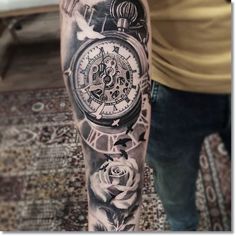 a man with a clock and roses tattoo on his arm