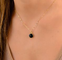 This dainty stone pendant necklace has a delicate chain. The chain is gold plated sterling silver 925., and there is an extension so that the size can be adjusted. The stones are natural stones and no 2 are identical, but they are similar. If you would like a custom order or have any questions please contact me, thanks. Black Round Minimalist Charm Necklaces, Minimalist Black Charm Necklaces, Minimalist Black Round Charm Necklaces, Minimalist Black Charm Necklace, Black Jewelry With Delicate Round Chain, Black Jewelry With Delicate Chain, Black Dainty Clavicle Charm Necklaces, Dainty Black Clavicle Chain Charm Necklace, Black Clavicle Chain Charm Necklace