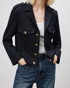 Relaxed, cropped jacket. Soft structured shoulder pads. Patch pockets, epaulettes and button back tabs. Signature crest buttons in gold. Fully lined. Model is 5'9 1/2 and wears a size 4.Model measurements are 31.5" bust, 24.5" waist, and 35" low hip. 100% VIRGIN WOOL, MADE IN USA OF IMPORTED FABRIC Military Blazer, Luxury Wardrobe, Structured Shoulder, Black Tank Dress, Black Aviators, Nili Lotan, Neon Purple, Cropped Jacket, Ruched Dress