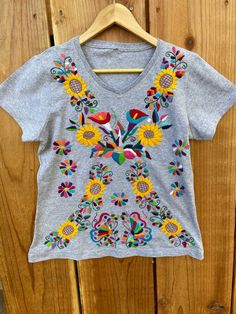 Multicolor Embroidered Cotton Shirt, Crew Neck Cotton Shirt For Festivals, Spring Cotton Embroidered Top With Machine Embroidery, Multicolor Floral Embroidery T-shirt For Summer, Summer T-shirt With Multicolor Embroidery And Short Sleeves, Summer T-shirt With Multicolor Embroidery, Summer Multicolor Embroidered Short Sleeve T-shirt, Summer Festival Embroidered Shirt, Summer Cotton Tops With Machine Embroidery