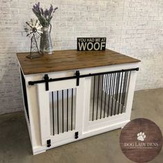 a dog crate with some flowers and a sign that says you had me at woof