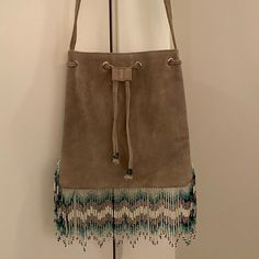 Star Mela Suede Drawstring Crossbody Beaded Bag Gray Suede Leather (Appears Lighter In Person) New Never Used Without Tags Non-Adjustable Strap Beads In Perfect Condition Everyday Beaded Bucket Shoulder Bag, Beaded Bucket Shoulder Bag For Everyday Use, Beige Beaded Festival Bags, Beaded Bag, Beaded Bags, Gray Suede, Suede Leather, Bead Work, Crossbody Bags