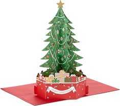 a christmas tree in a gift box on a red card