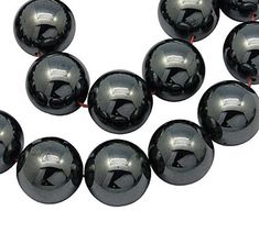 black marble beads with white letters on them