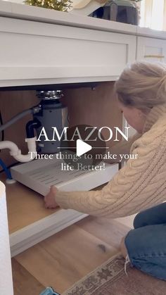 a woman kneeling down in front of an open drawer with the words, amazon three things to make your life better