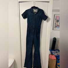 Never Worn - Dark Blue Denim Medium Wash Fitted Denim Jumpsuit With Short Sleeves, Fitted Medium Wash Denim Jumpsuit For Work, Fitted Medium Wash Jumpsuits And Rompers With Short Sleeves, Medium Wash Fitted Overall Jumpsuit, Fitted Medium Wash Overall Romper, Fitted Medium Wash Overall Jumpsuits And Rompers, Fitted Medium Wash Jumpsuit Overall, Fitted Medium Wash Jumpsuits And Rompers, Fitted Medium Wash Cotton Overalls