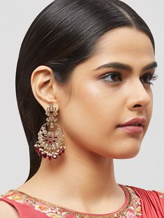 NAZRANAA JEWELS OFFERS A GREAT RANGE OF INDIAN JEWELRY FOR TODAY'S WOMAN WITH THE LATEST DESIGNS. THE BRAND IS COMMITTED TO PROVIDING ITS CUSTOMERS WITH THE HIGHEST QUALITY OF GOODS AND NEWEST DESIGNS. IT IS SUITED FOR A WOMAN WHO IS LOOKING TO STAY DATED WITH THE LATEST TRENDS. RADIANT ANTIQUE GOLD EARRINGS IN DIFFERENT COLOR PEARLS IS A PERFECT ACCESSORY FOR ANY NIGHT EVENT. IT IS SURE TO MAKE YOU STAND OUT IN A CROWDED ROOM. Traditional Indian Jewelry: Slight Color variations possible due to Gold Chandbali Earrings With Jewels, Red Drop Earrings Danglers For Wedding, Festive Jeweled Gold Earrings, Red Drop Danglers For Wedding, Gold Jeweled Pearl Earrings For Celebration, Temple Jewelry Style Jeweled Wedding Earrings, Temple Jewelry Jeweled Earrings For Wedding, Jeweled Drop Earrings For Celebrations, Festive Gold Jeweled Chandelier Earrings