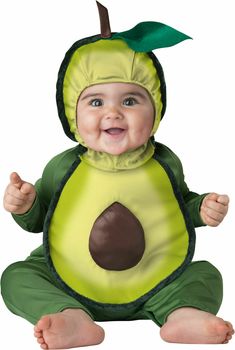 a baby dressed in an avocado costume