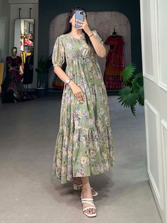 This pista green georgette frock dress with floral prints is a versatile and elegant addition to any wardrobe. Its timeless design, paired with the contemporary appeal of floral prints, makes it suitable for a wide range of occasions. 
This exquisite dress is crafted from premium georgette fabric, offering a soft and flowing silhouette that enhances every body type. Available in sizes XS to L, this fully stitched frock dress ensures a perfect fit, combining comfort with style.
The pista gre Frock Type Kurti Designs, Green Chiffon Midi Dress With Floral Print, Green Chiffon Midi Dress For Spring, Green Knee-length Chiffon Dress For Summer, Green Knee-length Chiffon Summer Dress, Knee-length Green Chiffon Dress For Summer, Summer Green Knee-length Chiffon Dress, Green Midi-length Chiffon Dress For Summer, Casual Green Chiffon Midi Dress