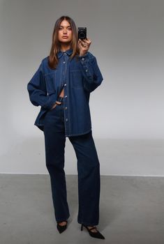 The Sana Shirt Blue by Nakedvice is an oversized denim shirt. Featuring pockets on the front chest and pleat detail at back, The Sana Shirt Blue is the perfect denim shirt. Pair with The Sana Skirt Blue for a complete look. 

Eden wears a size S and is 174cm tall. 
 Size: XS, S, M, L, XL, XXL; Colour: BLUE Cheap Trendy Denim Blue Shirt, Cheap Oversized Denim Top For Everyday, Front Button Down Jeans, Affordable Trendy Denim Blue Shirt, Maxi Shirt Denim, Affordable Washed Blue Button-up Jeans, Casual T-shirt For College, Womens Levi Denim Shirt, Denim Jacket As Shirt