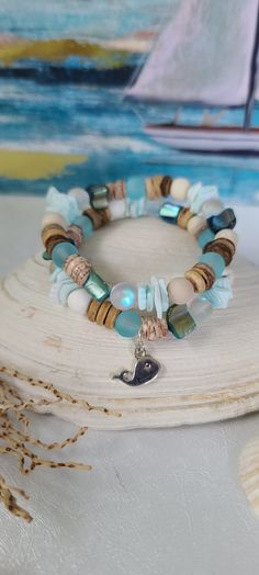 Mystic Aura Quartz, Coconut Shell, Wood, Frosted Blue Sea Glass, Matte Ivory Jasper, Natural White Turquoise, Seashells - Etsy Adjustable Bohemian Bracelet For Beach Season, Bohemian Stackable Stretch Bracelet For Beach, Bohemian Adjustable Stretch Bracelet For Beach Season, Bohemian Stackable Wrap Bracelet For Beach, Turquoise Hand Wrapped Wrap Bracelet For Beach, Handmade Blue Wrap Bracelet For Beach, Handmade Bohemian Stretch Bracelet For Beach Season, Bohemian Hand Wrapped Stretch Bracelet For Beach, Adjustable Hand-strung Wrap Bracelet For Beach