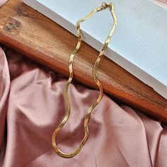 Introducing our all-new Luxe Gold Delicate Herringbone Chain – your stylish sidekick for every occasion! Whether you're rocking your favorite jeans and tee combo or glamming up for a night out, this chain has got your back. Versatility is the name of the game here. Whether you're a fan of minimalism or love a layered look, this necklace is your ultimate styling canvas. * 18k gold-plated stainless steel * Hypoallergenic * Tarnish resistant * Waterproof PVD Coating * Durability * Longer lifetime * Luxe Necklace, Curvy Girl Dress, Herringbone Chain Necklace, Pvd Coating, Herringbone Chain, Got Your Back, Graphic Tops, Layered Look, Your Back