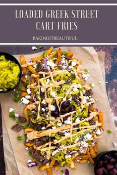 loaded greek street carb fries on parchment paper with olives and feta cheese