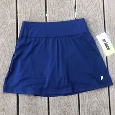 Prince Women's Tennis Match Knit Skort Size: Xs Color: Blue (Please See Pictures) * Regular Fit Tennis Skort * Lightweight Design Promotes Unrestricted Mobility * Included Spandex Undershorts Ensure Complete Coverage * Elastic Waistband Delivers A Secure Fit * Moisture-Wicking Fabric Helps Keep You Dry And Comfortable Casual Blue Sports Skort, Navy Stretch Casual Skort, Casual Navy Skort, Casual Stretch Blue Skort, Casual Blue Stretch Skort, Princes Fashion, Tennis Skirt Black, Prince Tennis, Pleated Fashion