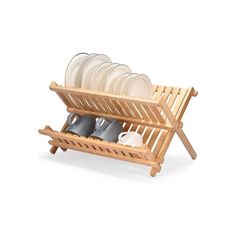 a wooden dish rack with plates and cups in it