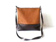 "Vegan leather crossbody messenger colorblock cognac brown and dark brown handbag purse. Exterior: - Bottom - high quality vegan leather in dark chocolate brown -Top - high quality very durable vegan leather in cognac brown camel color * Interior: - Available with natural cotton polka dot lining in sandy beige and white, natural linen geometric print pattern in light beige, plain chocolate brown cotton or stripped cotton. Please choose the lining you prefer from Variations. * Two inside slip poc Brown Shoulder Bag With Adjustable Strap For Fall, Brown Crossbody Shoulder Bag For Business, Brown Crossbody Shoulder Bag For Fall, Brown Business Crossbody Shoulder Bag, Brown Crossbody Satchel With Adjustable Strap, Brown Leather Backing Crossbody Shoulder Bag, Brown Leather Backing Crossbody Bag, Modern Brown Satchel With Adjustable Strap, Brown Faux Leather Satchel For Fall