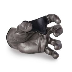 a metal hand holding a black object in it's palm