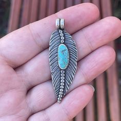 I love making these feathers, this cutie has a blue Kingman turquoise with brown matrix.  She has been heavily textured and oxidized to bring out all the details and give her a rustic vintage feel. Measurements:  54mm x 18mm Comes on a 20" sterling silver adjustable chain.  Option to purchase without the chain can be found in the drop-down menu. Turquoise's properties are water-like and can instill a sense of calm within you. It has been celebrated over time as a stone of protection and tranquil Turquoise Bohemian Jewelry With Feathers, Bohemian Turquoise Jewelry With Feathers, Jewelry Nature, Feather Necklace, Feather Pendant, Silver Feather, San Bernardino, Feather Necklaces, Kingman Turquoise