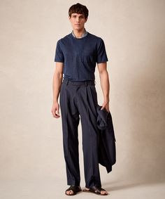 Equal parts tailored and dramatic, our Wythe Suit Pant is a casual take on the traditional pleated trouser in a modern, oversized but tailored fit. A natural waist and double reverse pleats (which face out, away from the fly) lead to a relaxed fit through the legs for a vintage-inspired look. This pant is crafted from Casual Workwear Bottoms With Box Pleat, Pleated Pants Men, Interchangeable Wardrobe, Sweatshorts Shorts, Polo Coat, Suit Pant, Linen Suits, Navy Suit, Classic Suit